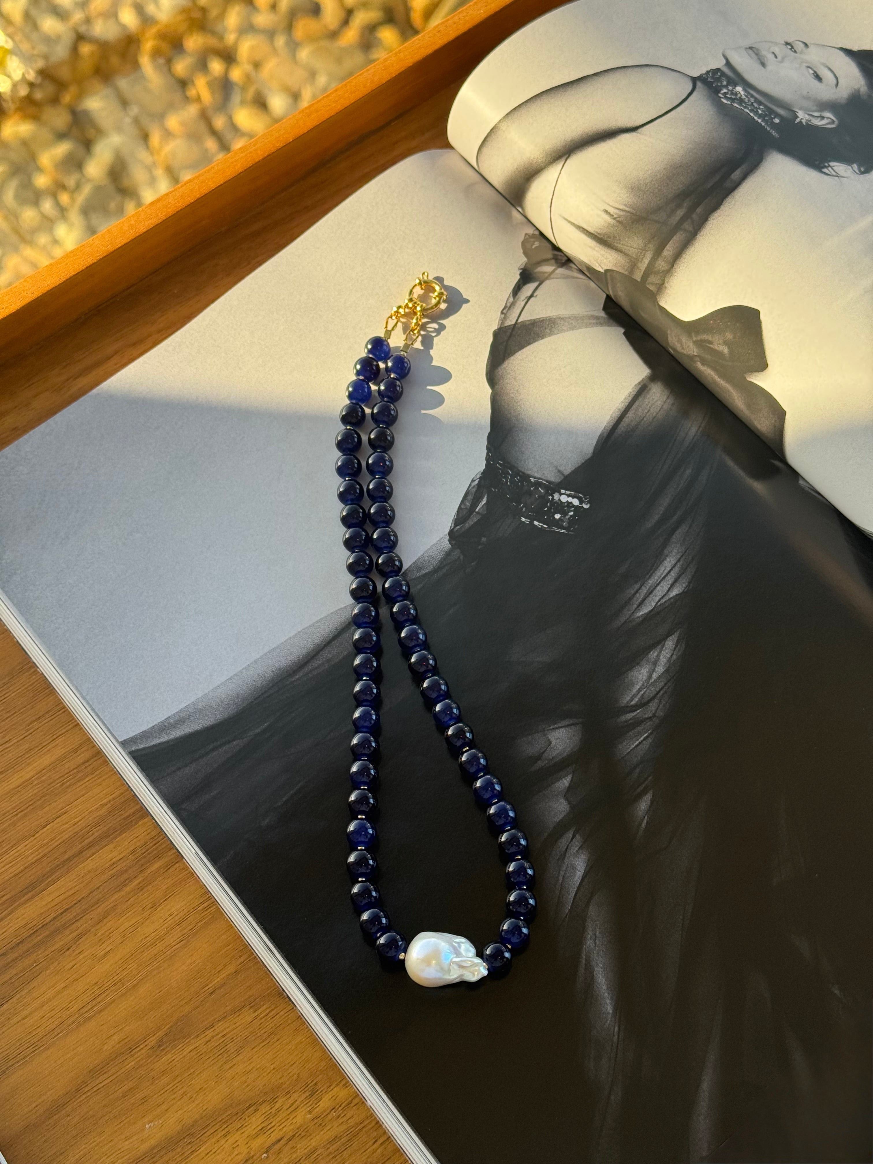 Handmade blue glass bead necklace with freshwater baroque pearl focal.
