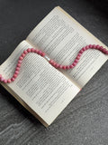 The Muse Necklace in red — dusty-rose glass beads with baroque stick pearl, handmade by Salty Gypsy