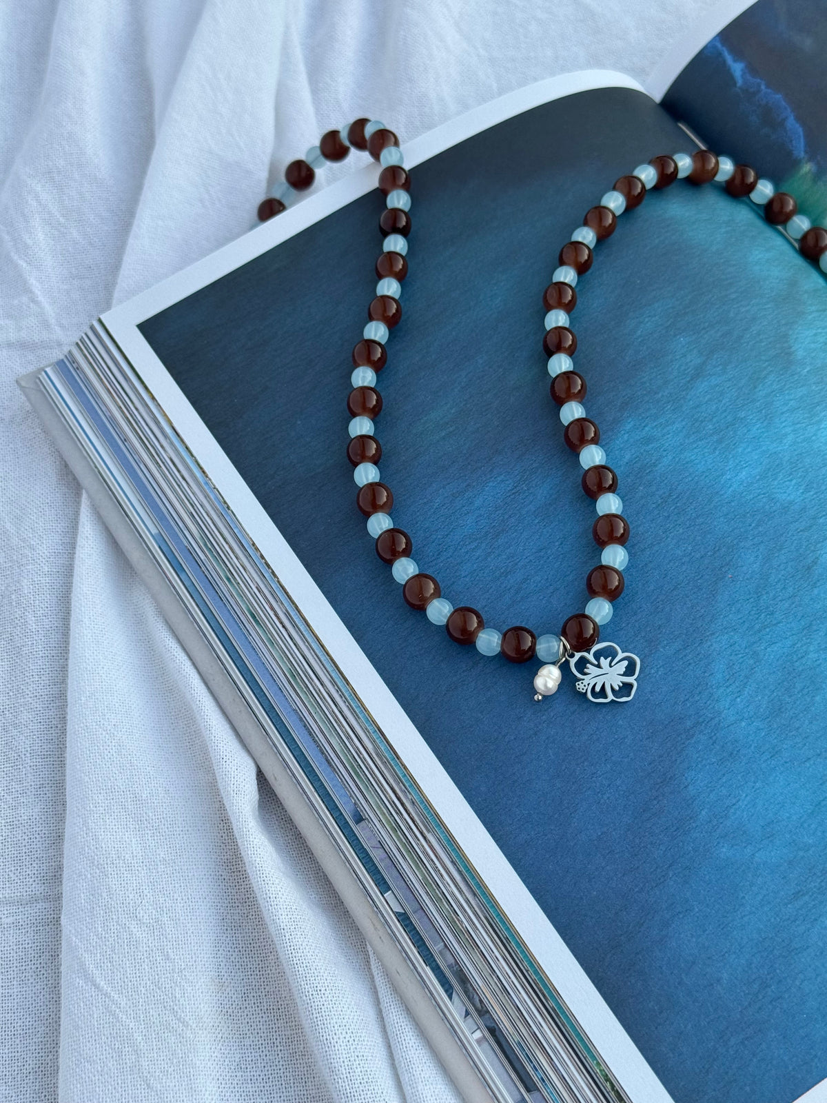 Blue Crush Silver beaded necklace handmade with glass beads, hibiscus charm and rice pearl by Salty Gypsy