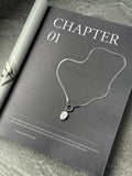 Margot silver herringbone chain necklace with oval baroque pearl pendant, handmade by Salty Gypsy