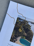 Nixie Gold Chain — stainless steel curb chain with spiral shell pendant, handmade by Salty Gypsy