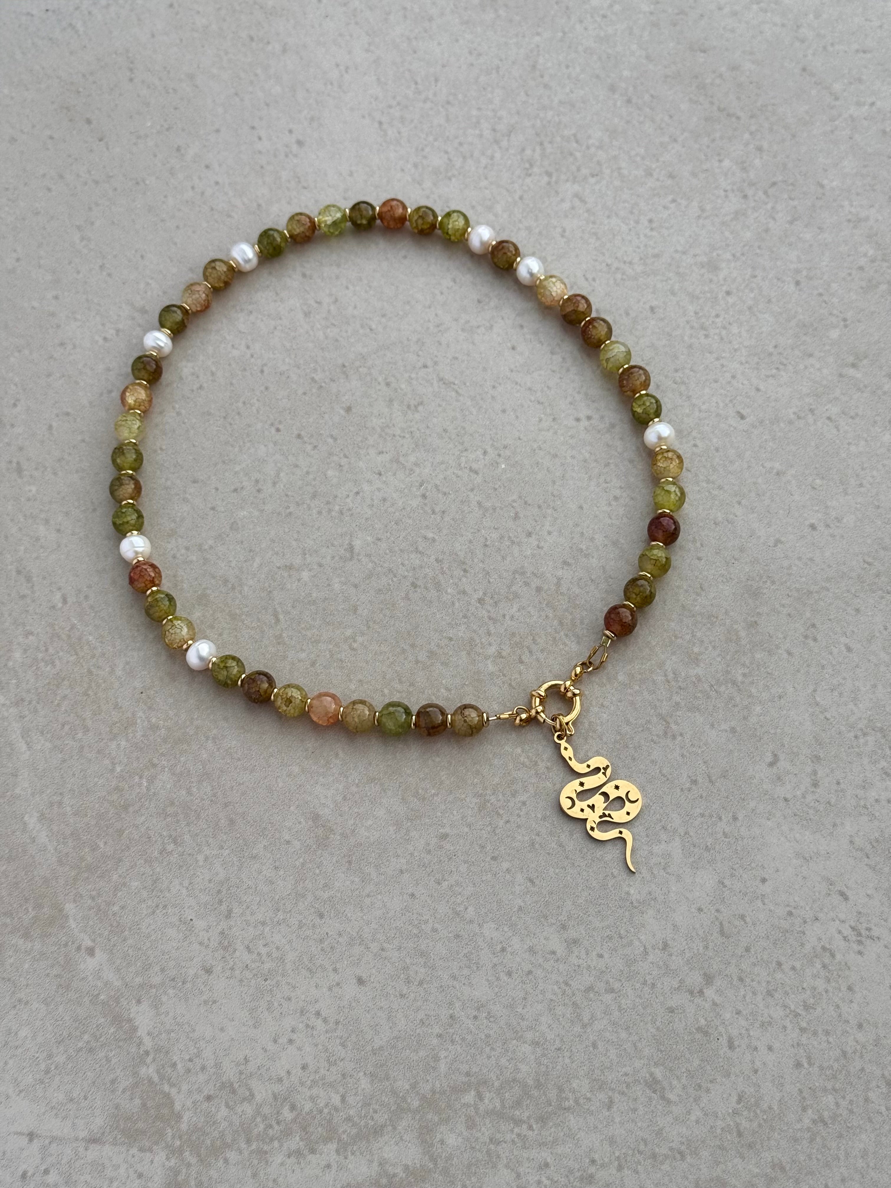 Nyx Necklace in green and gold — moss green glass beads with scattered pearls and removable snake charm, handmade by Salty Gypsy