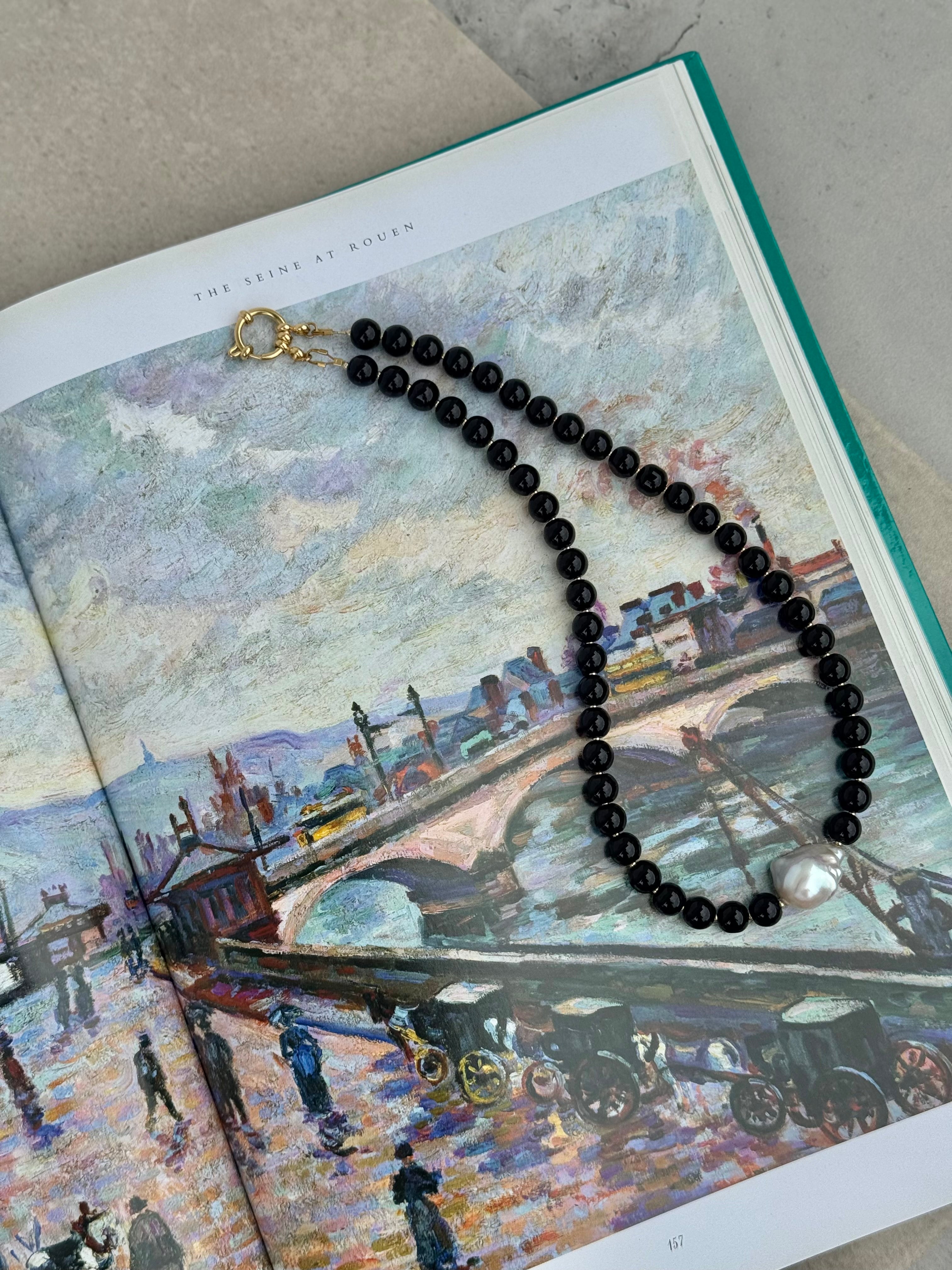 Sloane necklace featuring black glass beads, baroque fireball pearl and gold detailing, handmade jewellery by Salty Gypsy
